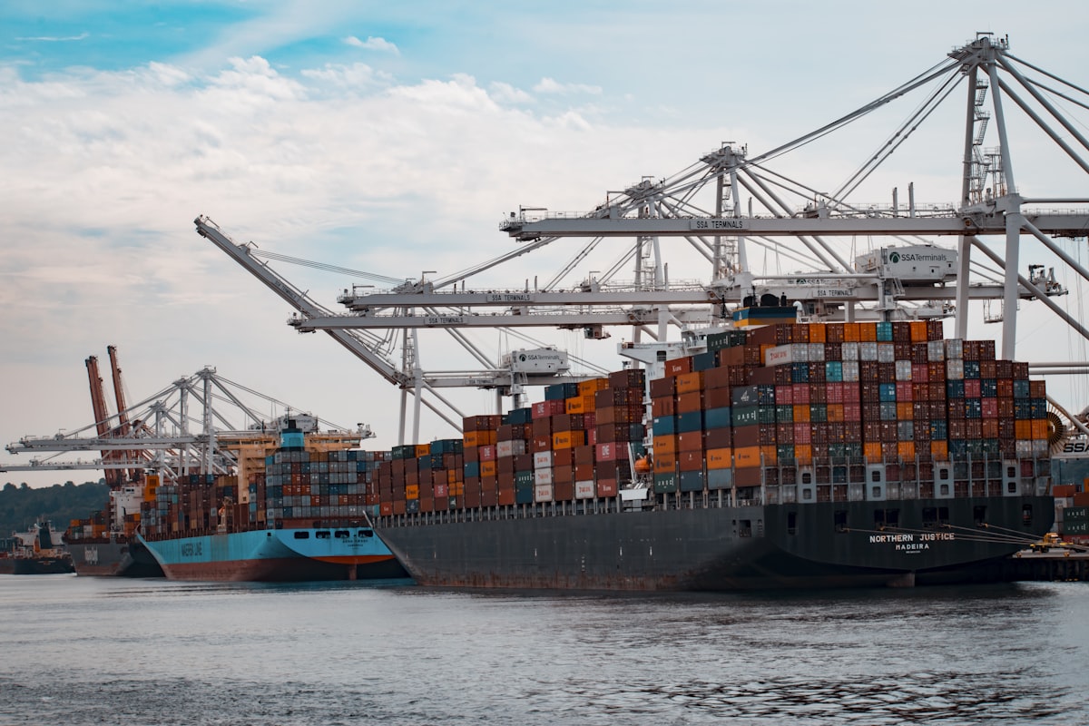 Container ship at port representing EU-India trade and carbon border adjustment